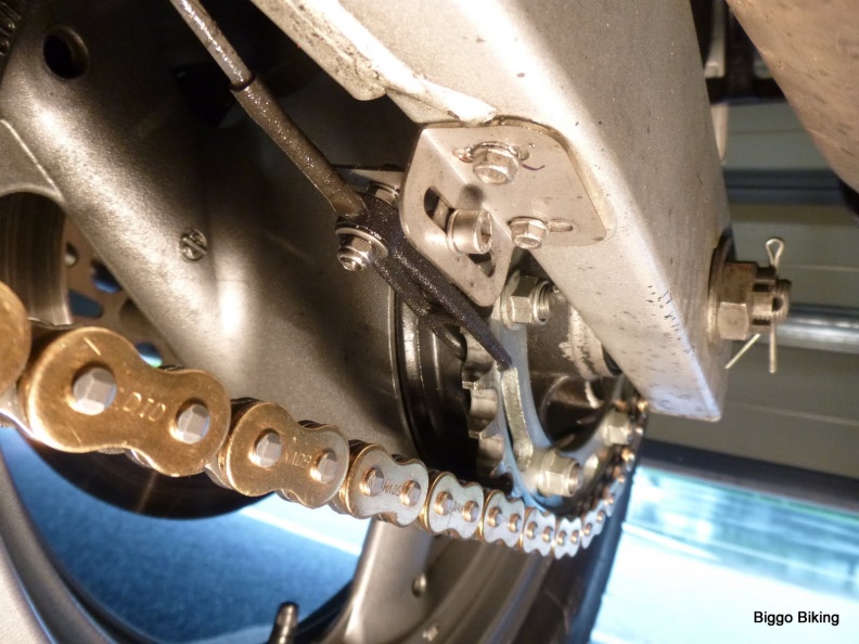 This is from another bike with a rectangular swing arm, but nozzle bracket is attached in similar fashion nozzle on swing arm.JPG
